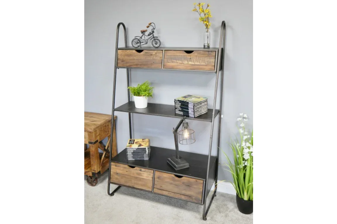 Industrial shelving unit with metal frame, wood drawers, decorative books and table lamp