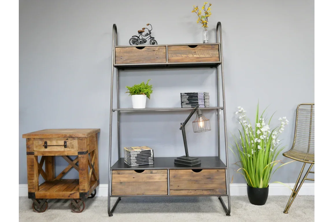 Industrial wood and metal shelving unit with drawers, styled with plants and decor items
