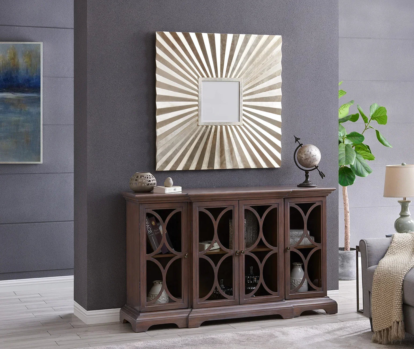 Dark wood sideboard with glass doors and geometric pattern in modern living room setting