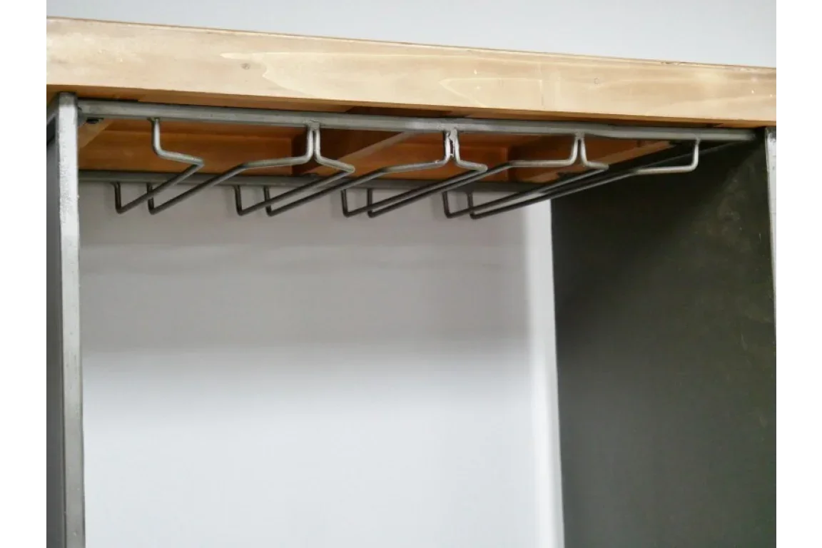 Metal wine glass rack mounted under wooden shelf inside modern cupboard
