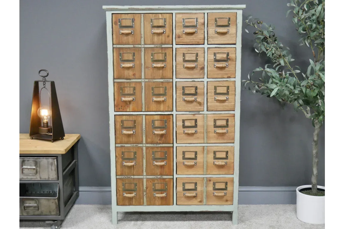 Vintage wooden multi-drawer cabinet with metal handles in living room setting