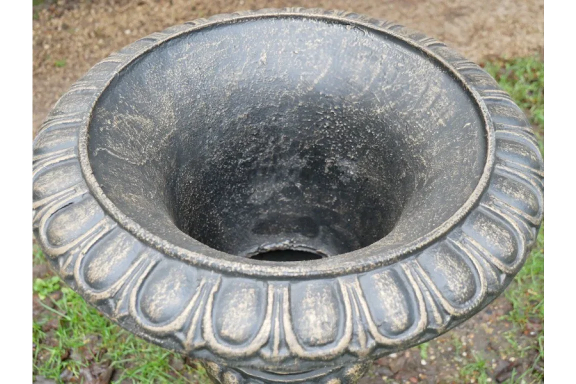 Black stone-effect garden planter with fluted edge and weathered finish