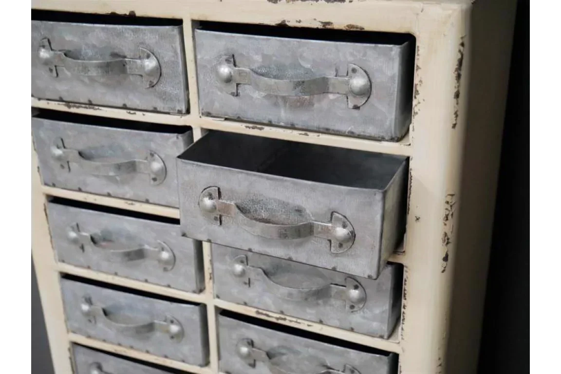 Industrial metal storage drawers with distressed cream frame, one drawer partially open
