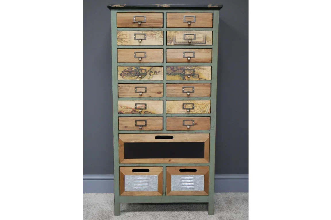 Vintage tall chest of drawers with wood, metal, and map print panels against grey wall