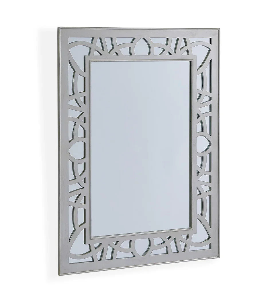 Rectangular wall mirror with silver geometric cut out frame, angled side view