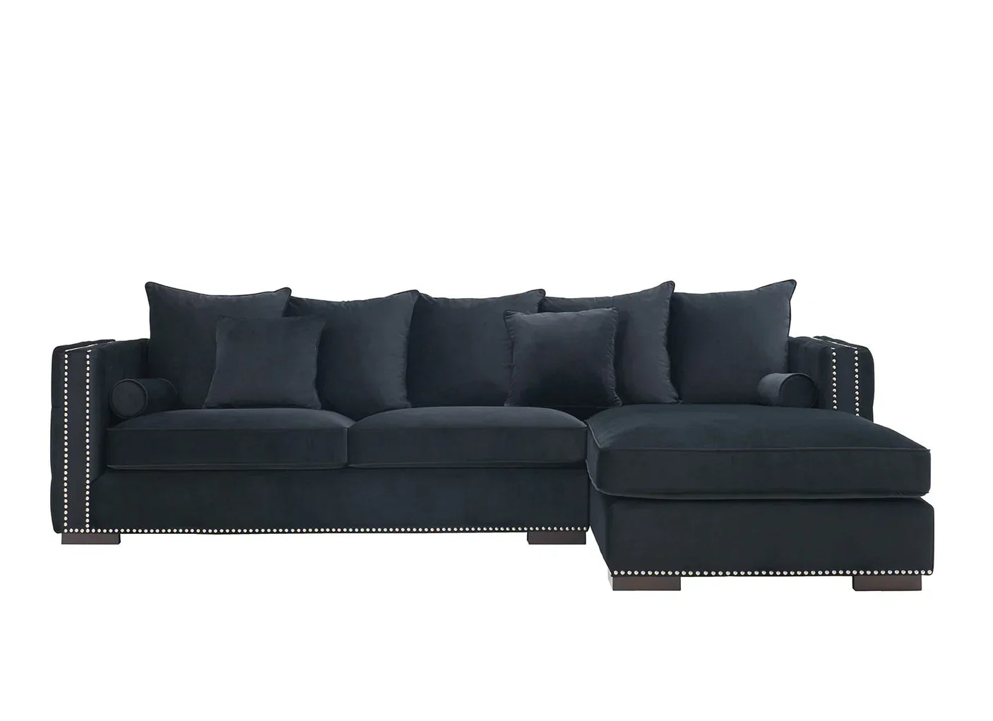 Black velvet corner sofa with studded trim and multiple scatter cushions, right-hand chaise design