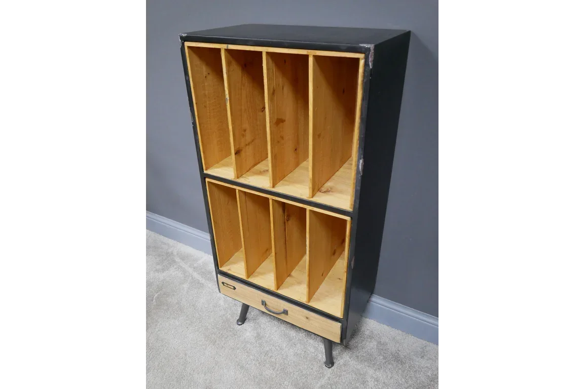 Tall wooden storage cabinet with open compartments and a single drawer on metal legs