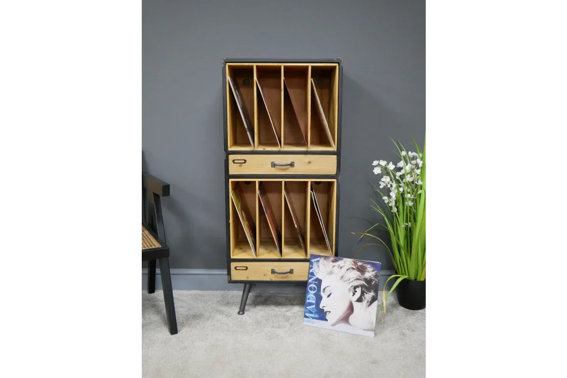 Wooden record storage unit with two drawers and vinyl dividers beside potted plant
