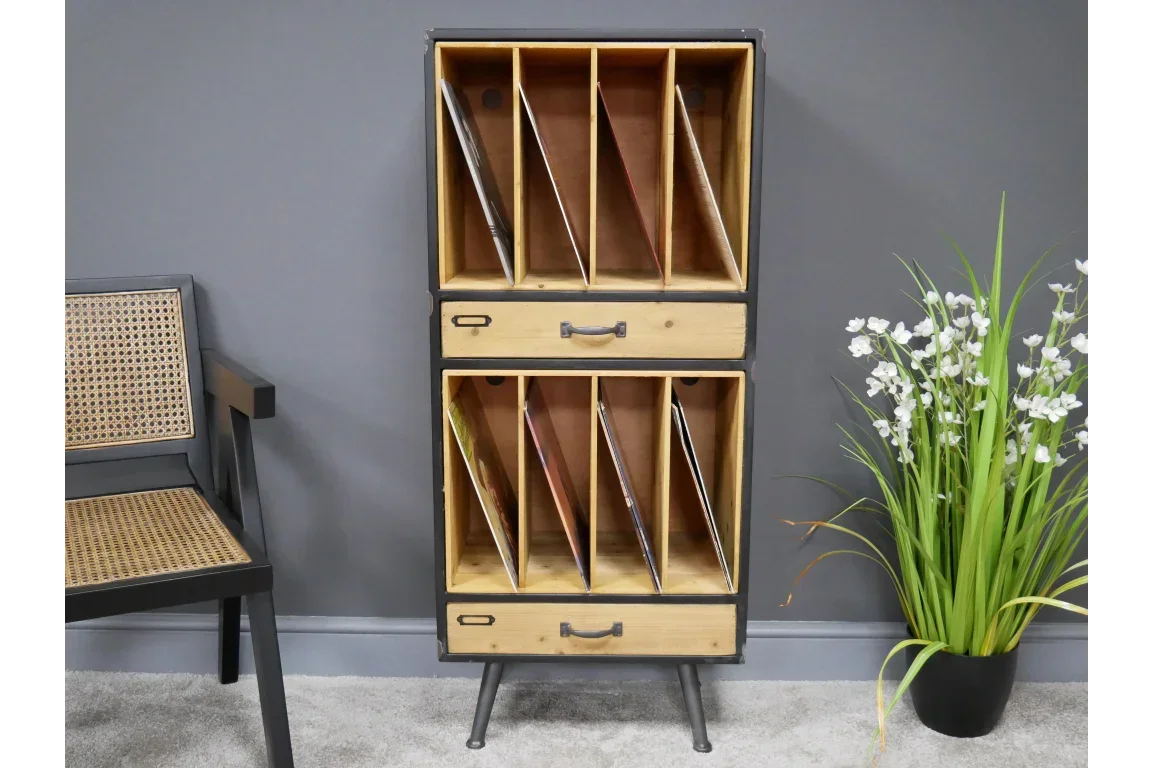 Wooden storage unit with vinyl record dividers and drawers, set against grey wall