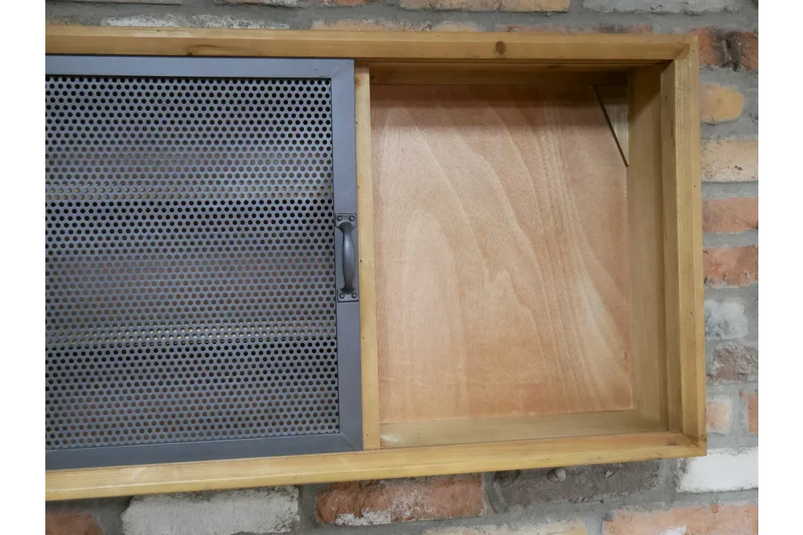 Wooden wall storage cabinet with metal mesh sliding door and handle, fixed on brick wall