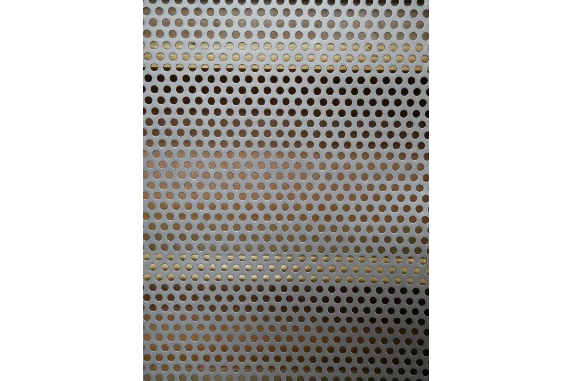Brushed metal furniture panel with round perforated holes in a uniform pattern