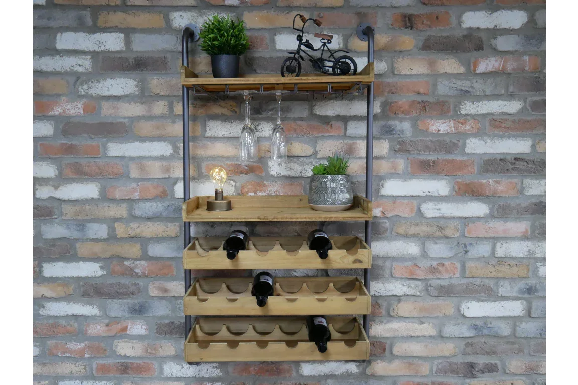 Wall-mounted wooden wine rack with bottle shelves and glass holders against a brick wall