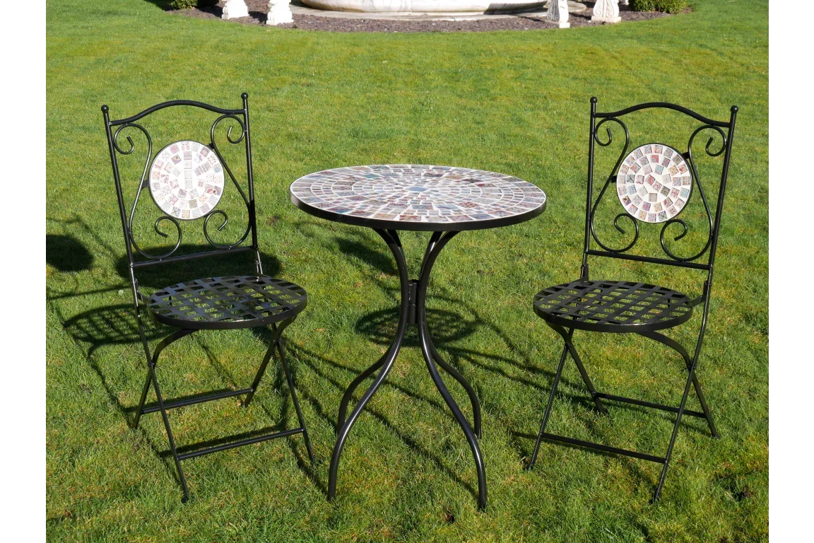 Mosaic bistro set with round table and two metal chairs on lawn