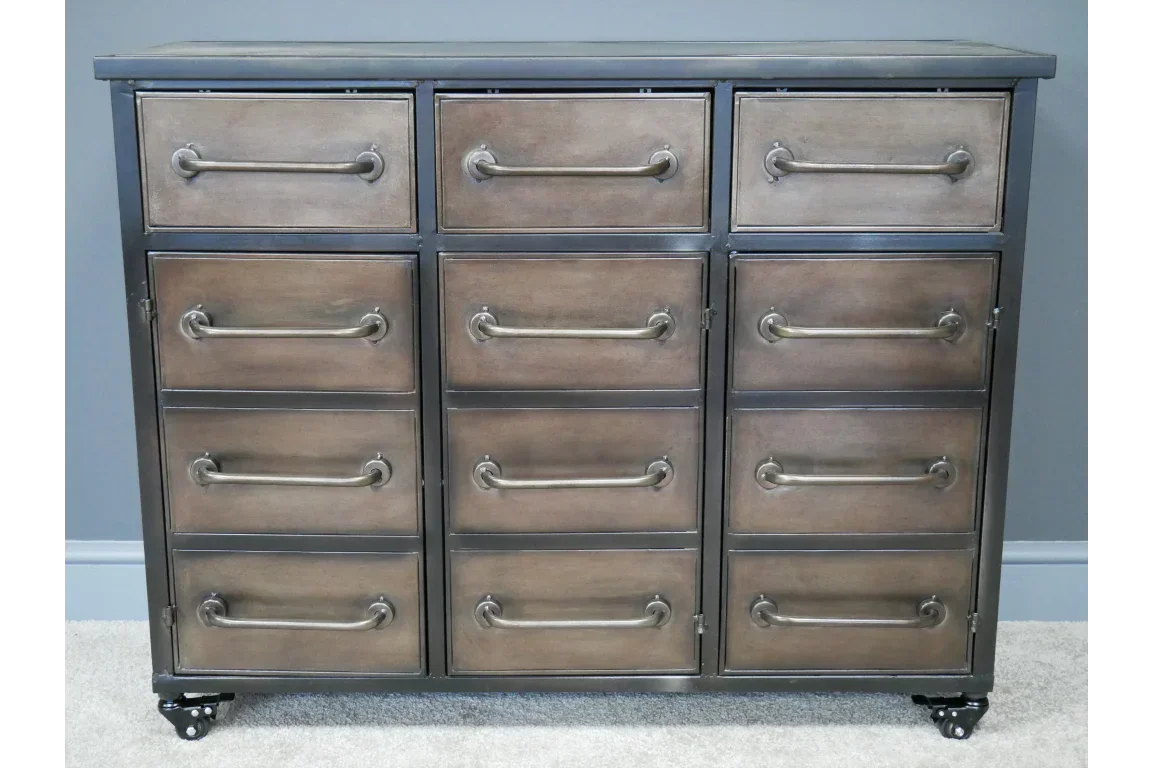 Industrial sideboard with twelve drawers, metal handles, and castor wheels on carpet