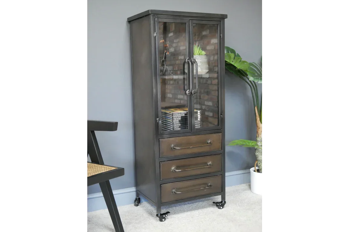 Industrial display cabinet with glass doors, three drawers and metal handles on castor wheels