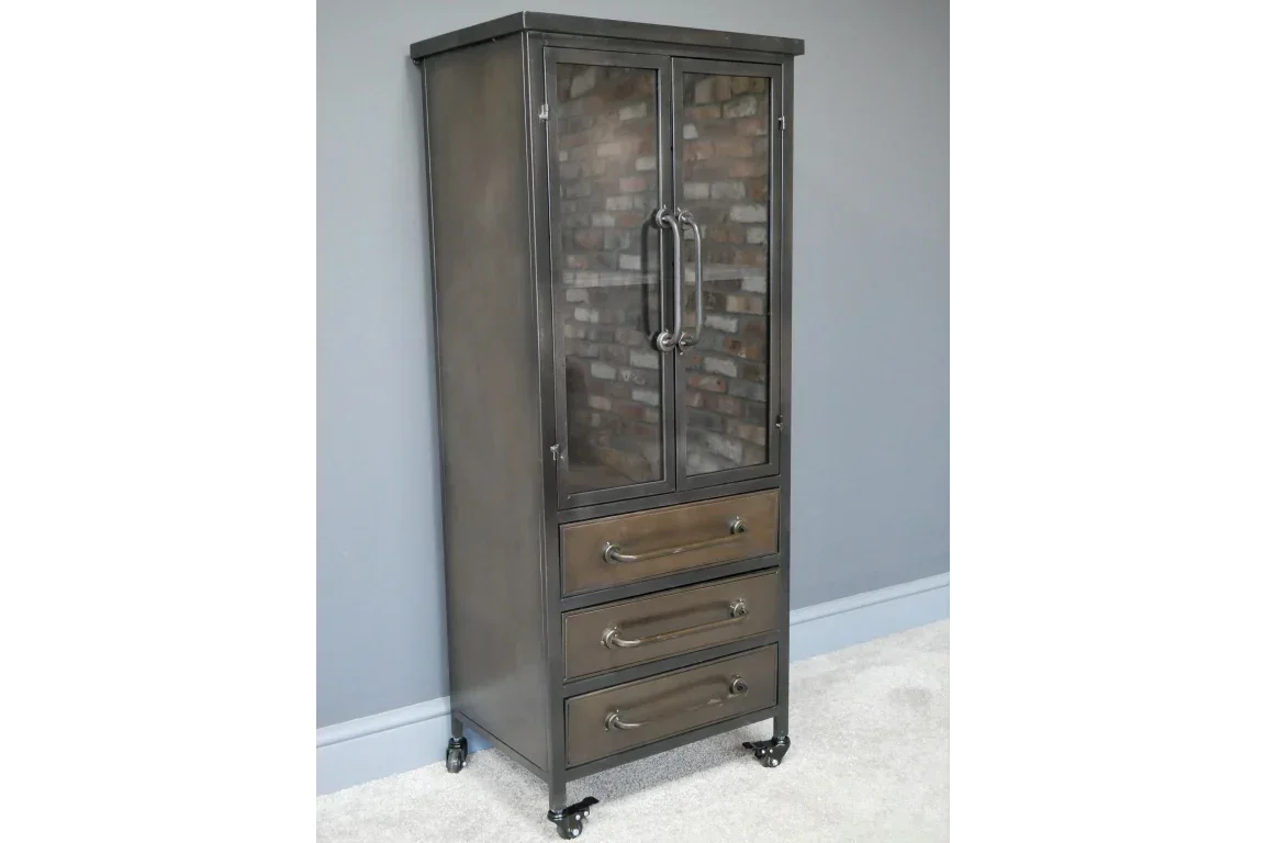 Industrial metal storage cabinet with glass doors and three drawers on caster wheels