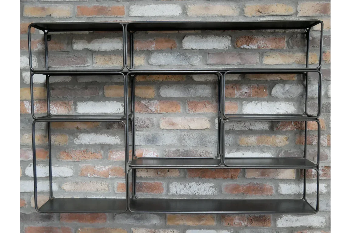 Black metal wall shelf with geometric compartments on exposed brick wall