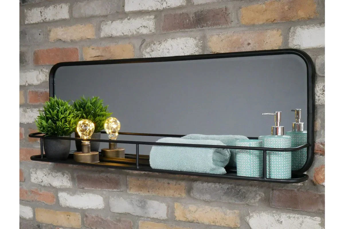 Wall mirror shelf with black metal frame, holding towels, soap dispensers, plants, and bulbs