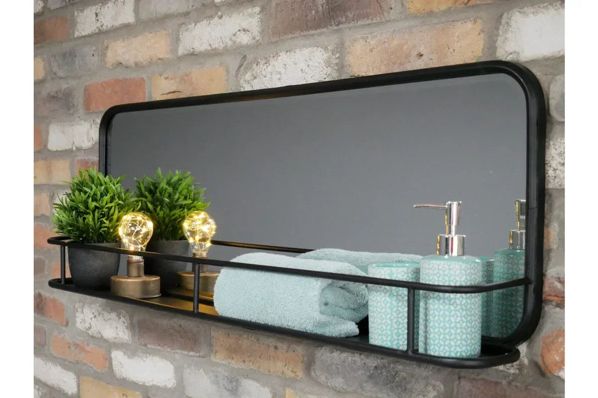 Black metal bathroom mirror shelf with towel, plants, lights and blue soap dispenser