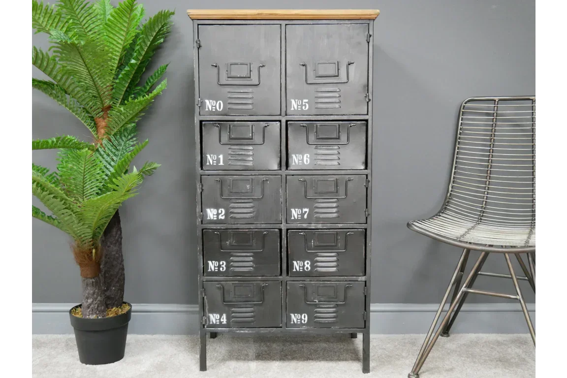 Black metal industrial storage cabinet with numbered drawers and wood top, indoor setting