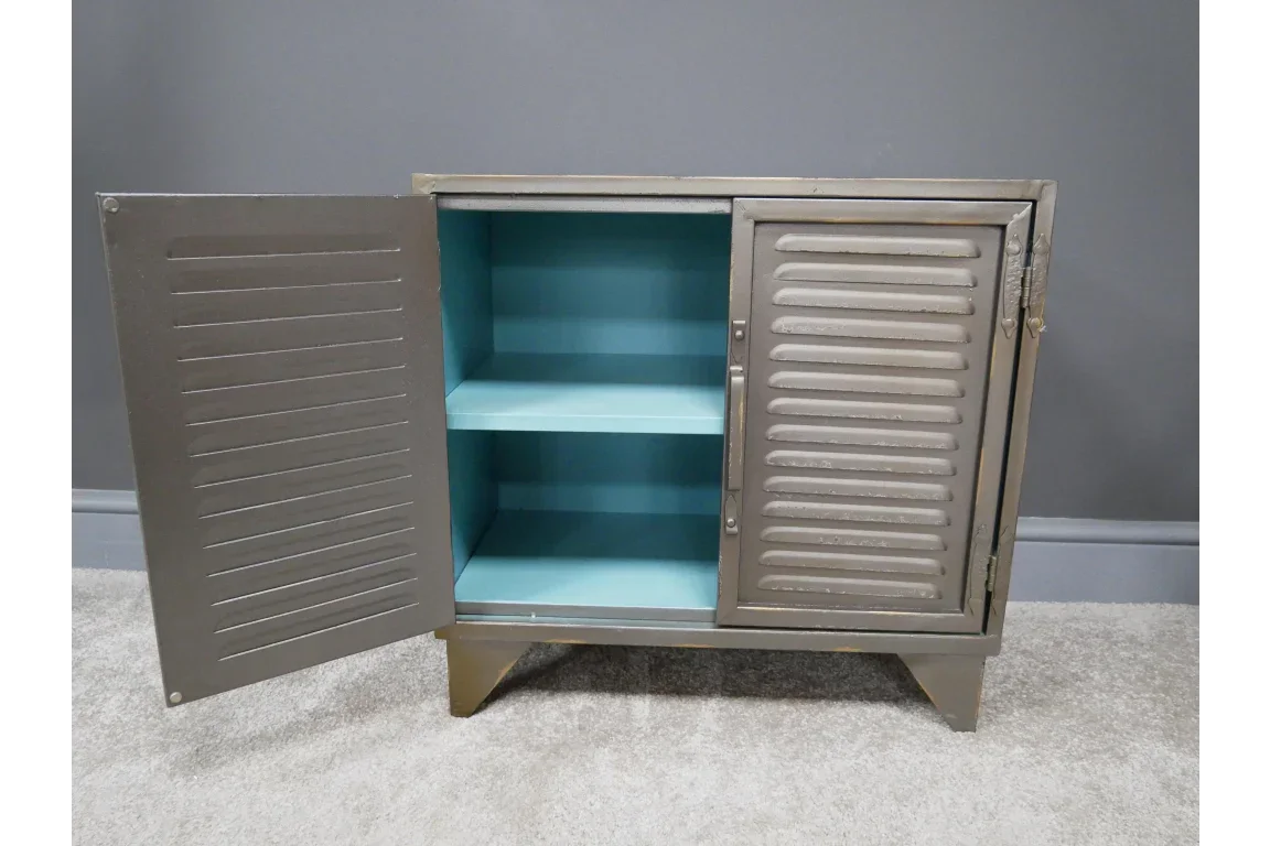 Metal storage cabinet with two louvre doors, blue interior and single shelf, on carpet
