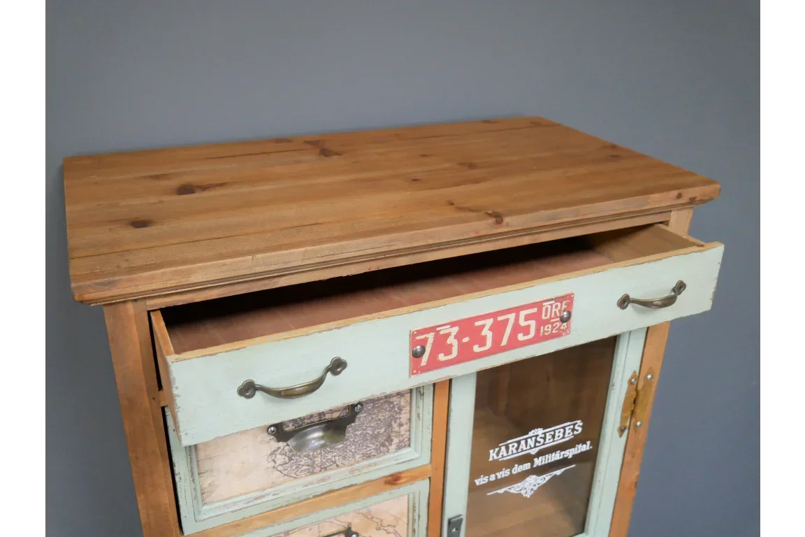 Rustic wooden cabinet with open top drawer, metal handles and vintage detailing