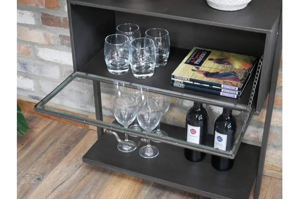 Industrial style drinks cabinet with glassware, wine bottles and books on metal shelves