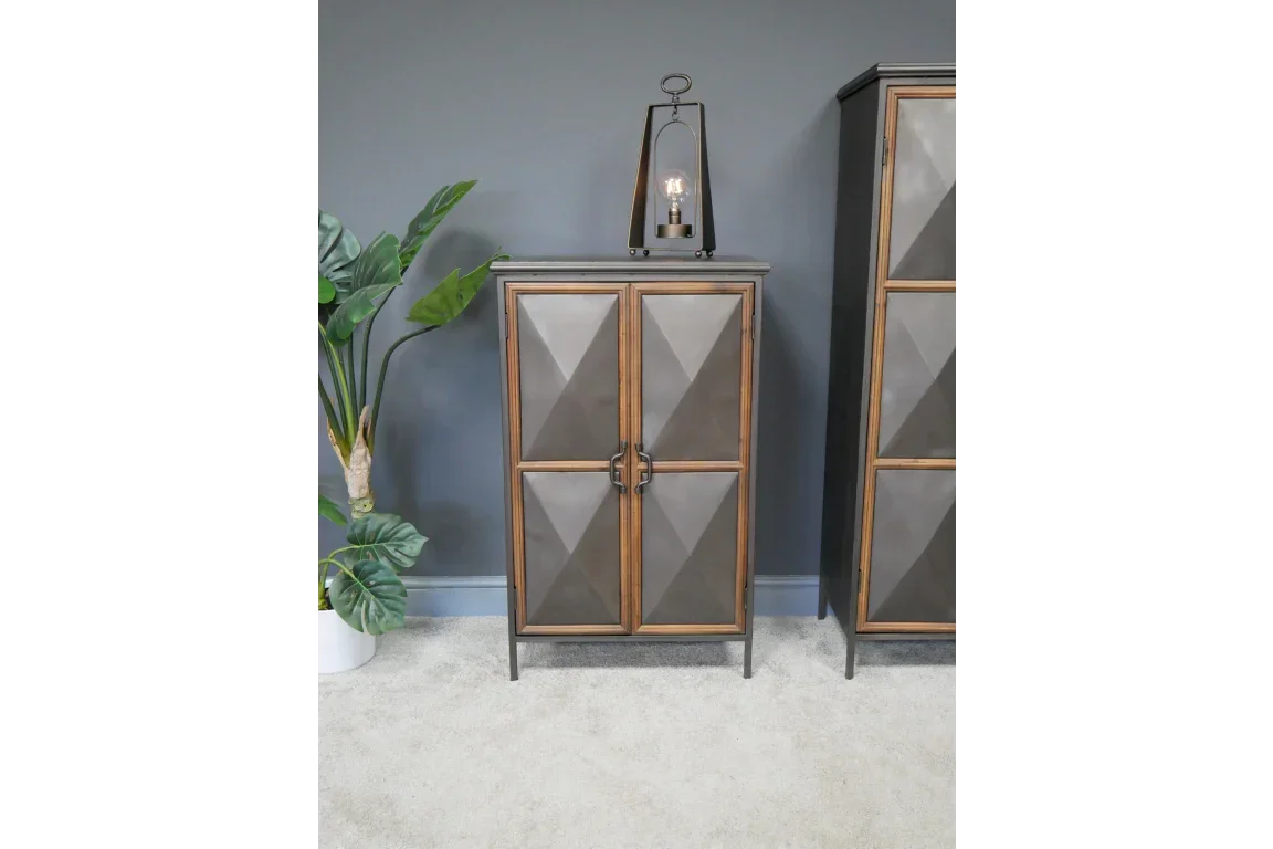 Geometric wood and metal storage cabinet with double doors in modern living room setting