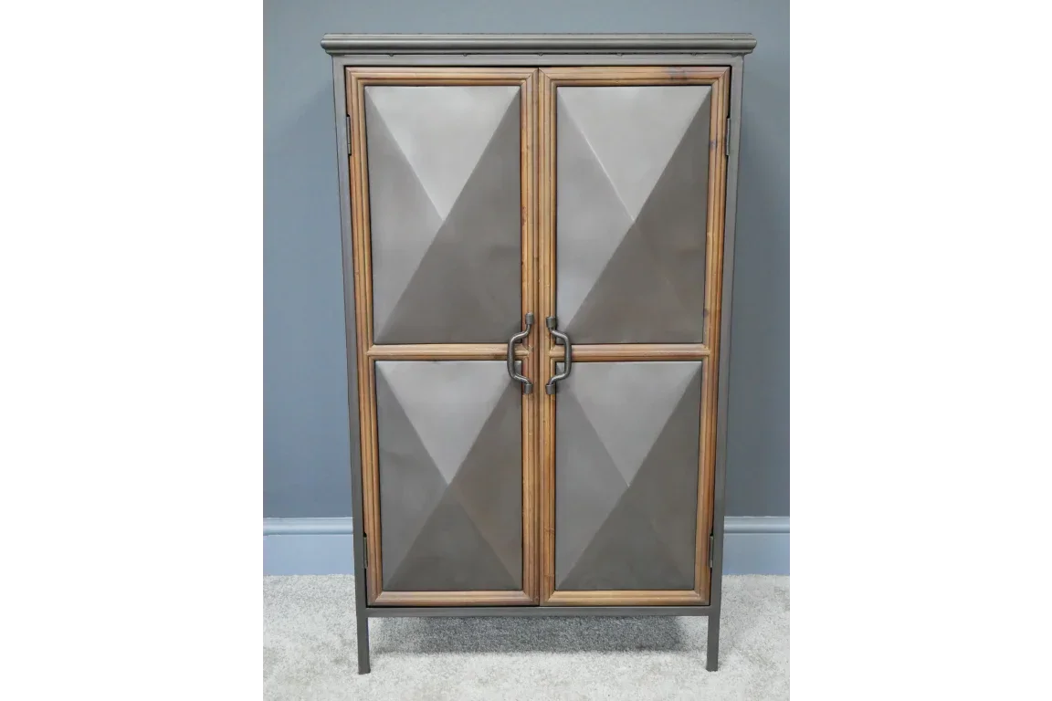Geometric metal and wood cabinet with two doors and modern handles against grey wall
