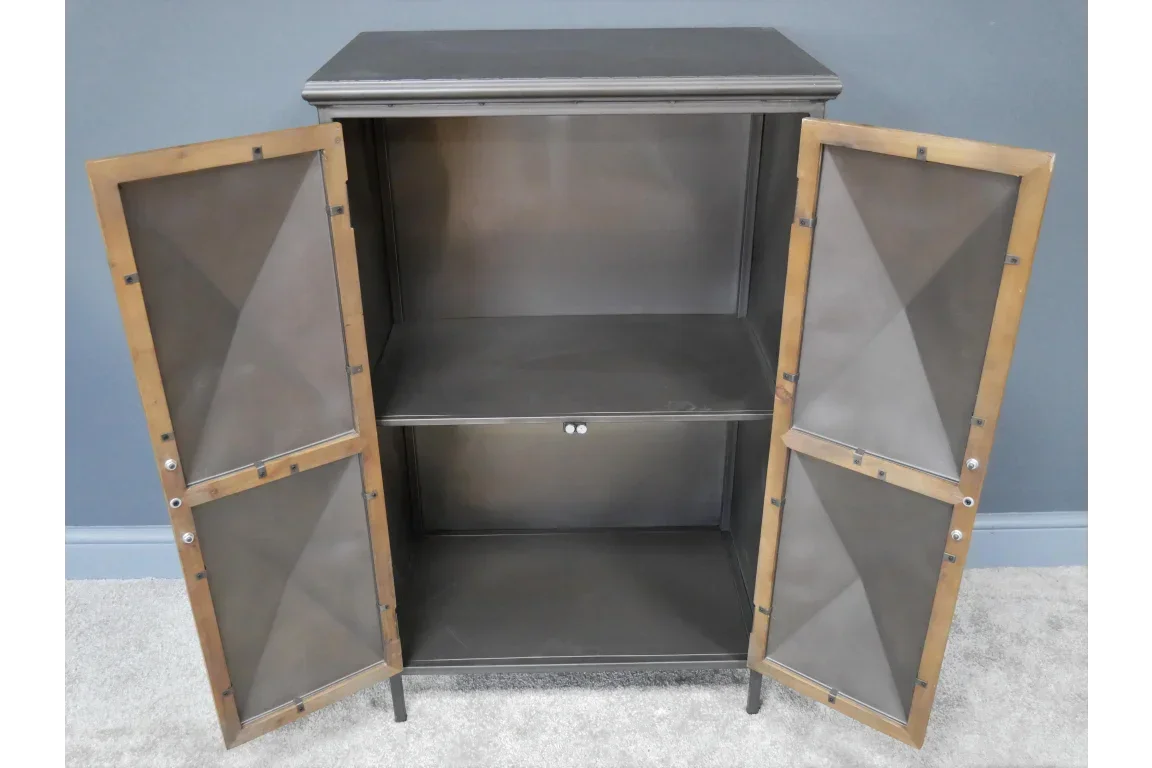 Industrial metal storage cabinet with open doors and two shelves against a blue wall