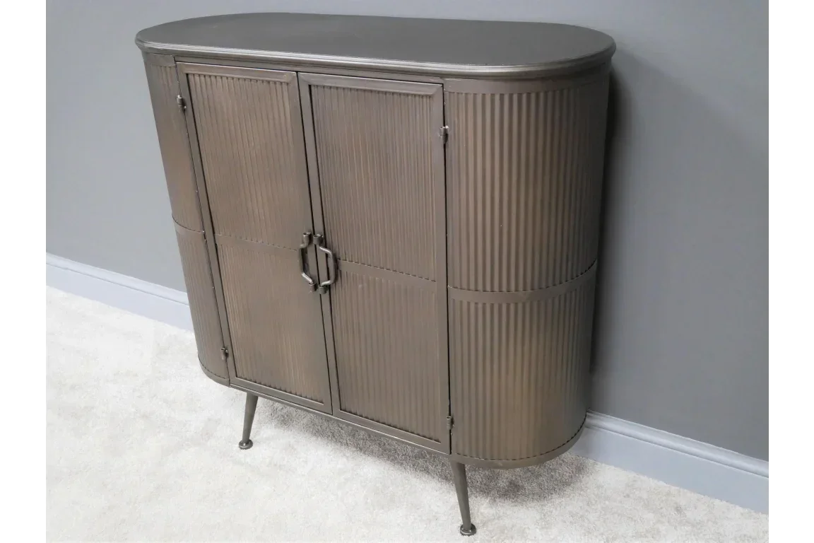 Metal sideboard cabinet with ribbed doors and rounded edges, standing on four legs