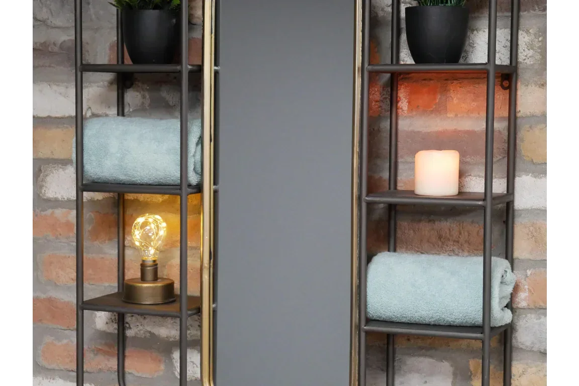 Industrial wall shelf unit with mirror, rolled towels, potted plants, light bulb and candle