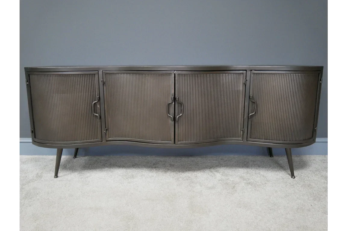 Metal sideboard with four ribbed doors and curved front on tapered legs