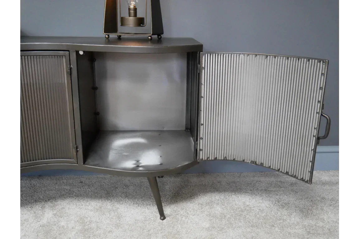 Metal sideboard open cupboard showing ribbed door and interior shelf