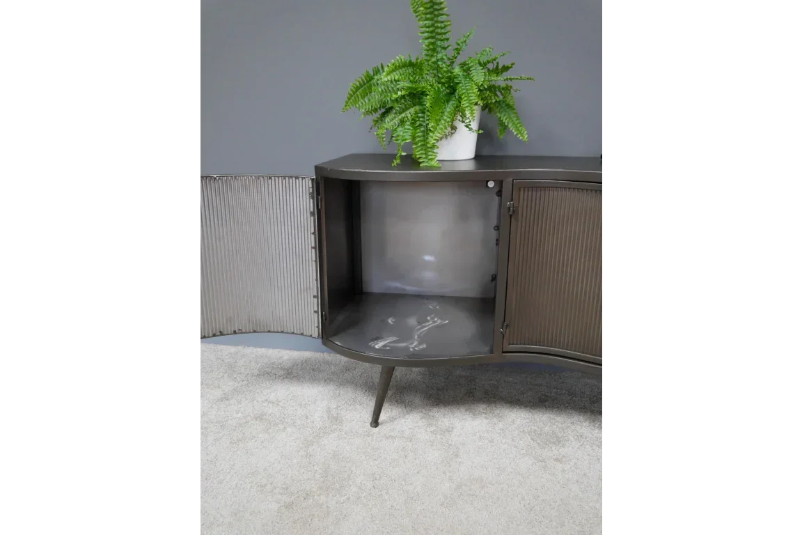 Dark wood sideboard with ribbed doors open, interior visible, potted fern on top