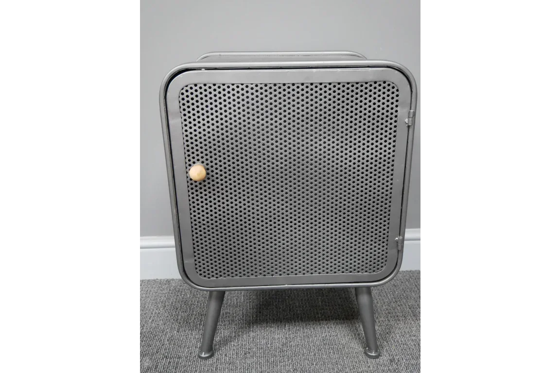 Metal bedside cabinet with perforated door and wooden knob on grey carpet