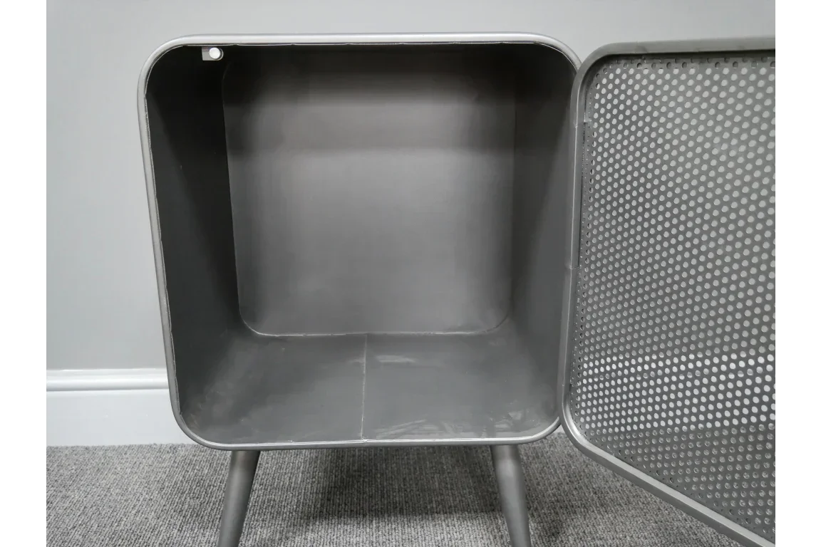 Grey metal side table with perforated door open and storage compartment visible