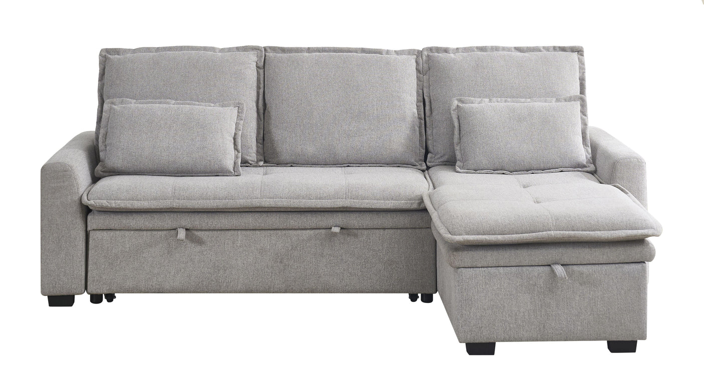 Grey fabric corner sofa with storage chaise and scatter cushions, front view