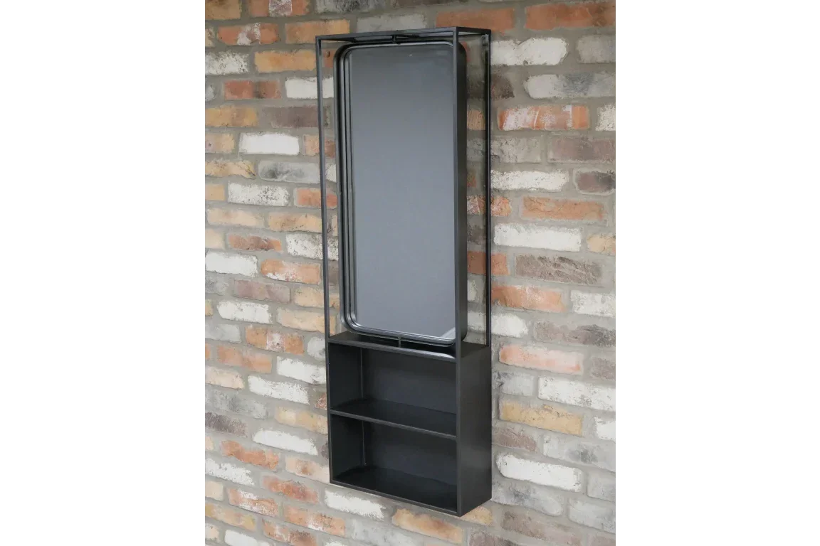 Black metal wall mirror with shelves mounted on exposed brick wall