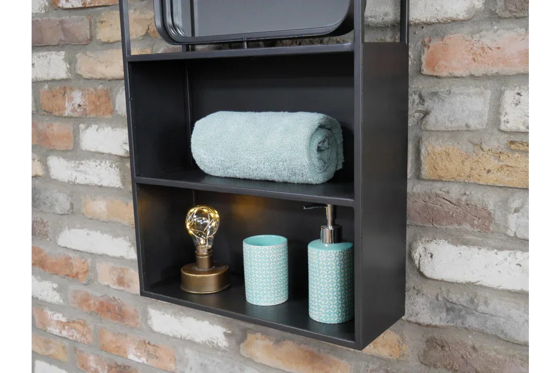 Black wall shelf unit with rolled towel, decorative lamp, soap dispenser and tumbler