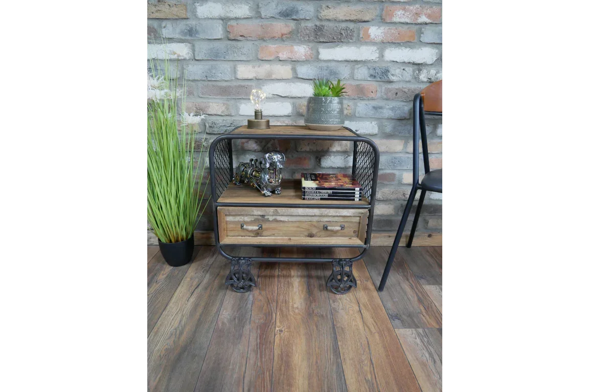 industrial side table with metal frame, wooden shelf, drawer and decor against brick wall