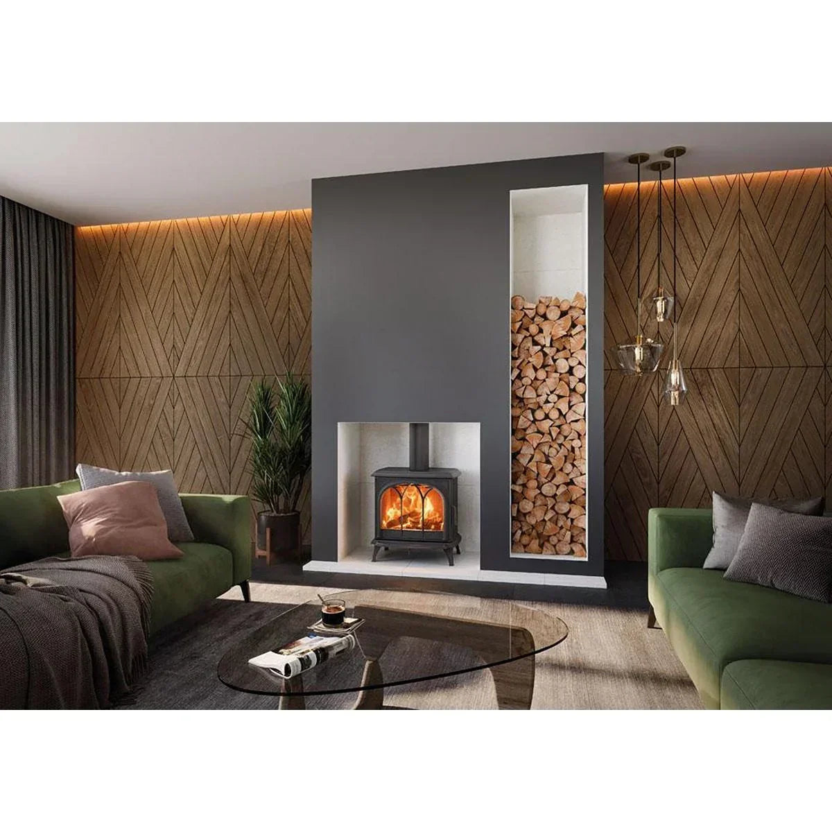 Modern living room with wood burning stove, green sofas, log storage, and geometric wall paneling