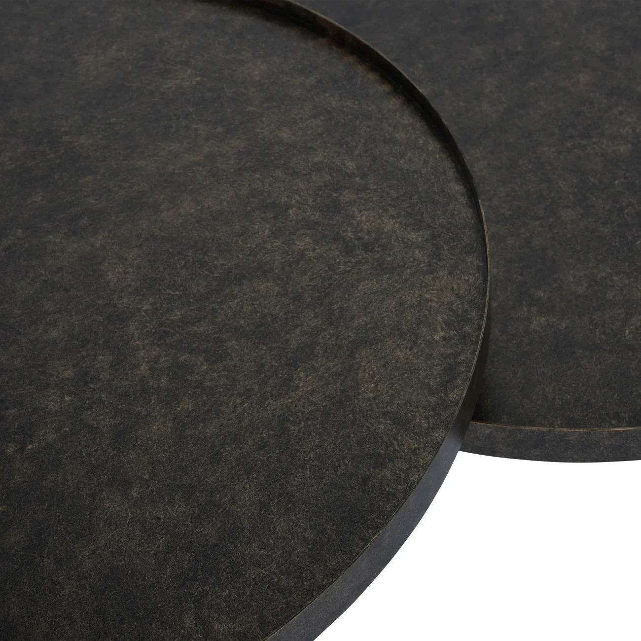Rustic antique gold iron table tops with textured surface detail.