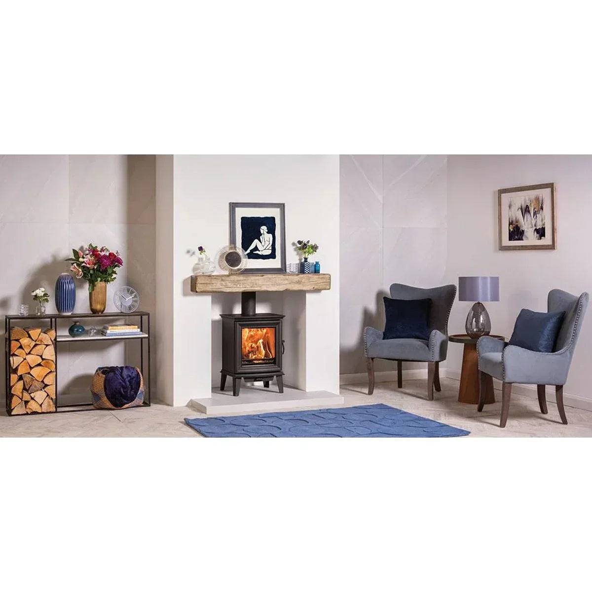 Contemporary living room with two grey armchairs, wood-burning stove and modern furniture