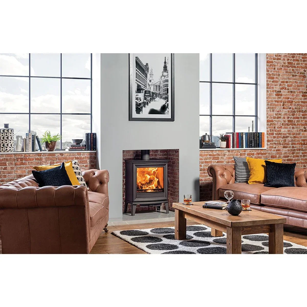 Brown leather sofa set with wooden coffee table and fireplace in a modern living room