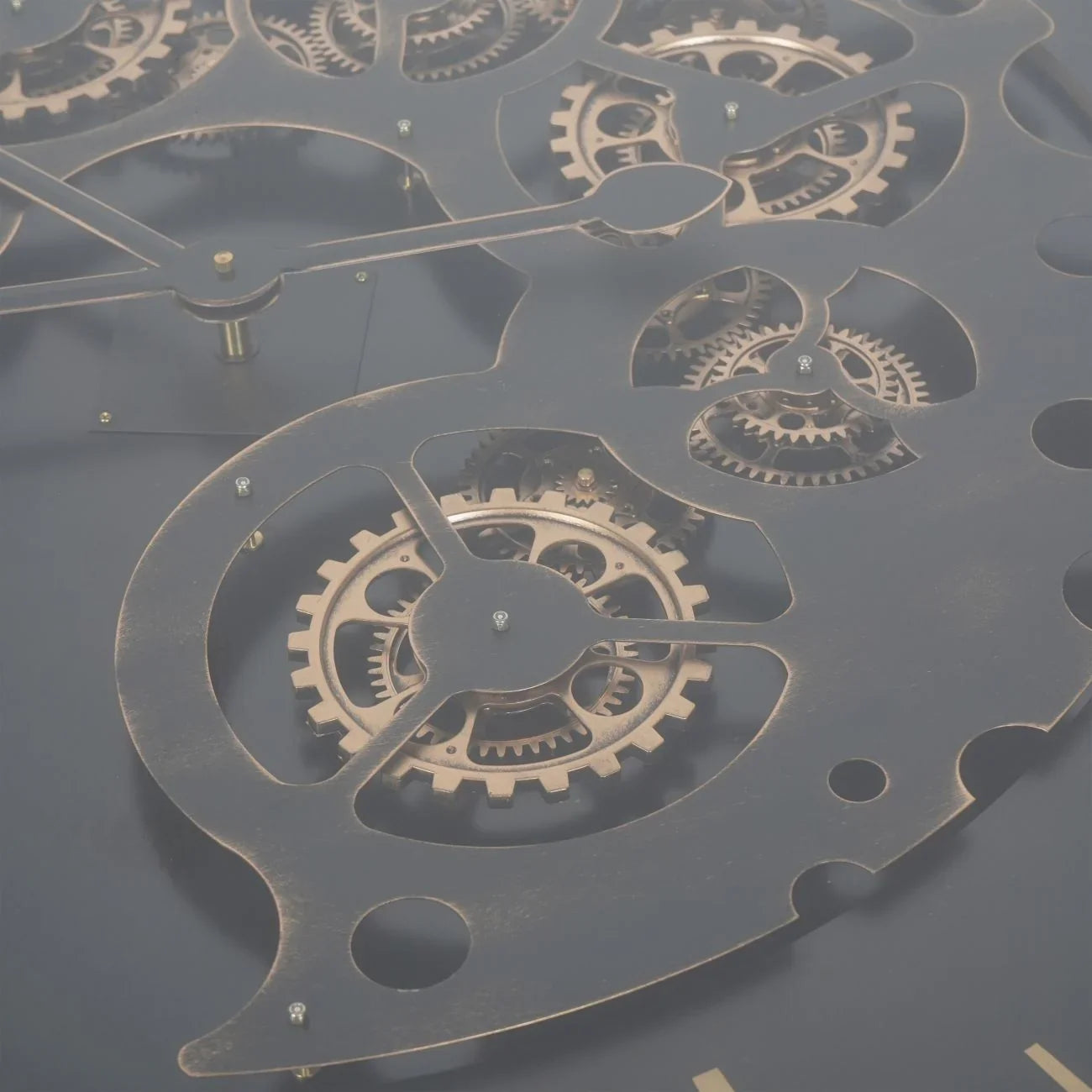 Black and gold table detail with intricate moving cogs.