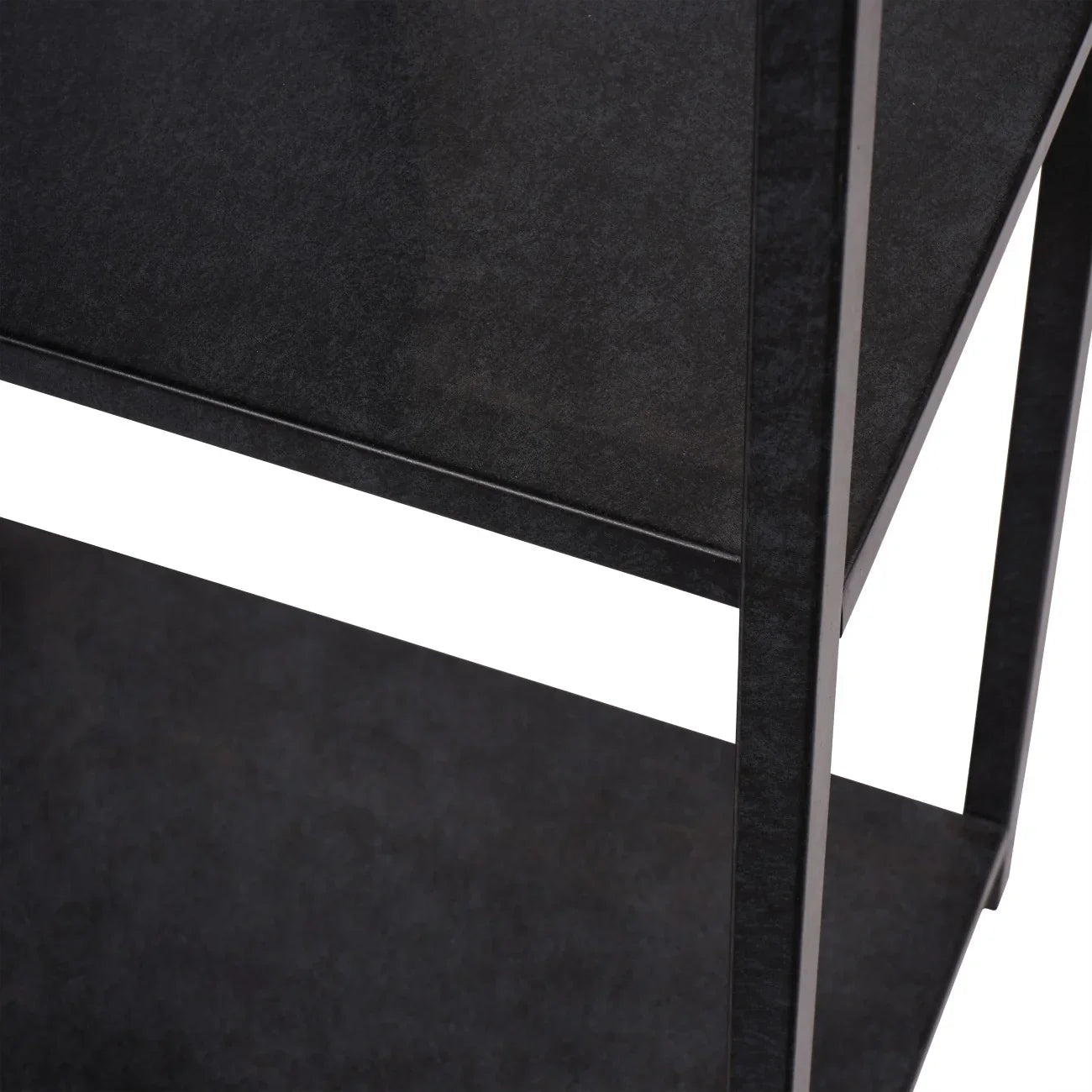 Mottled black metal shelving unit with textured surface detail.