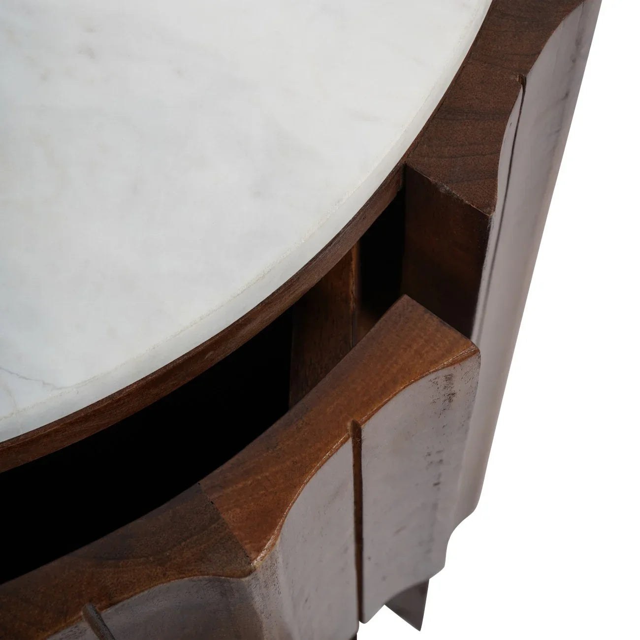 Curved wooden bedside corner with white marble top detail.