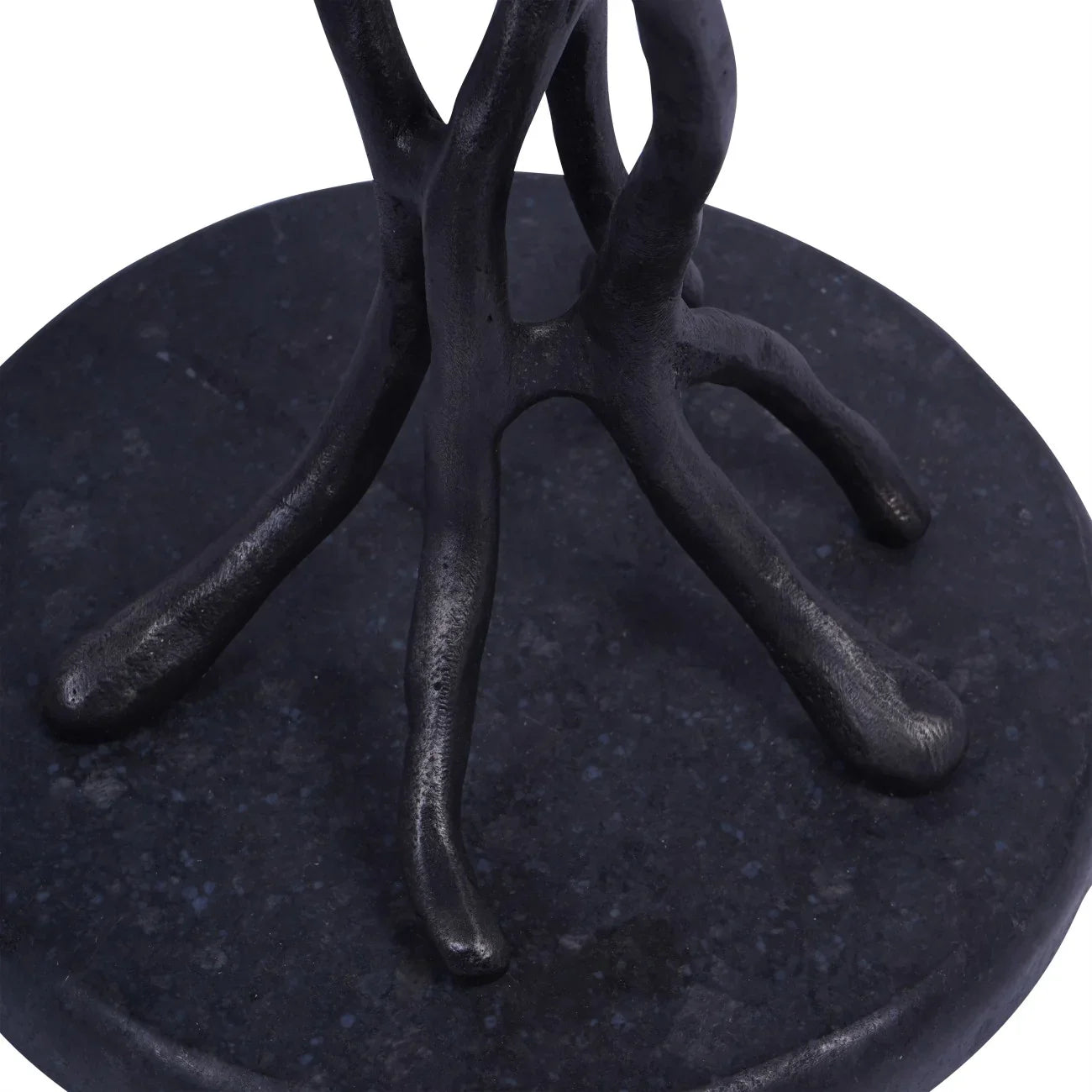 Black cast aluminium table base with organic branch-like design.