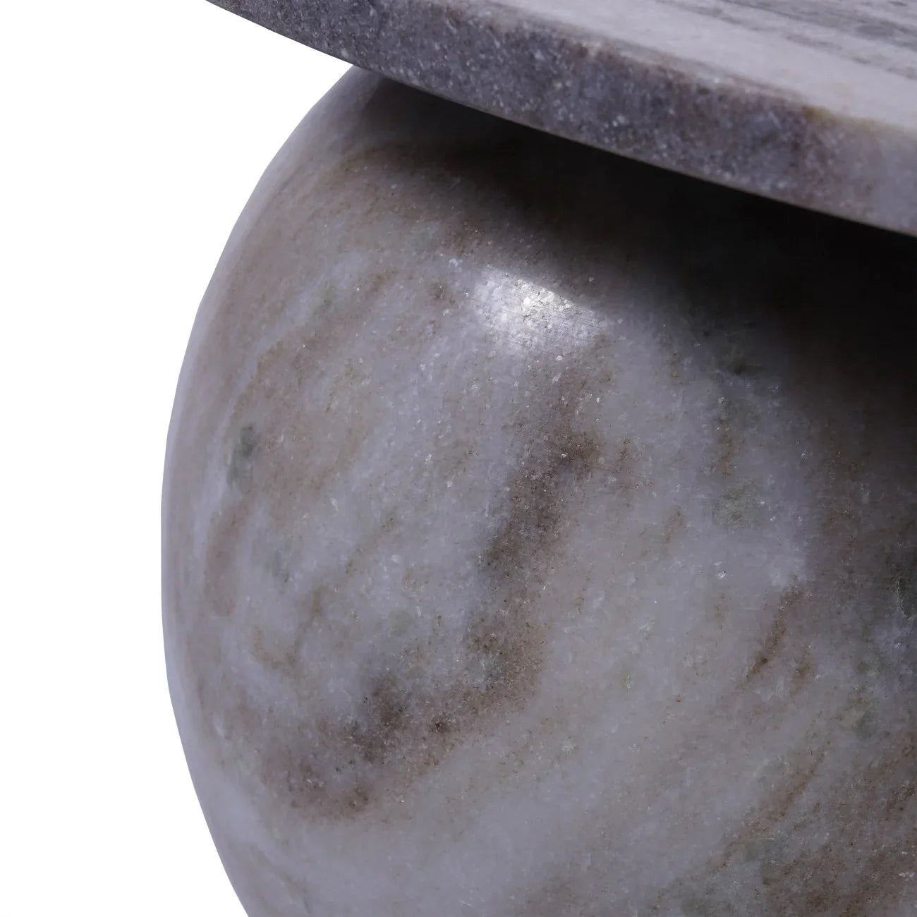 Close-up of marble coffee table leg with smooth, natural stone texture.